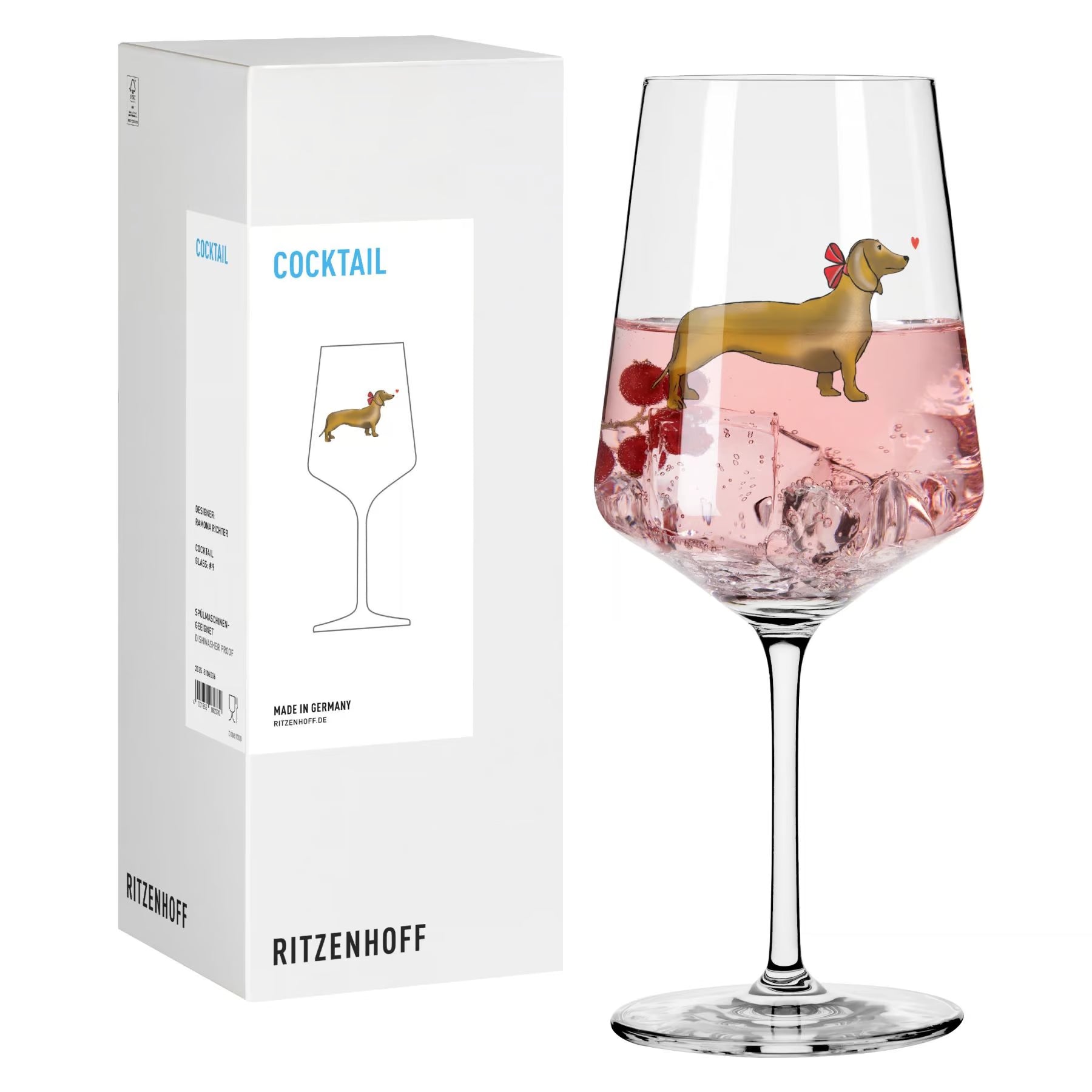 Cocktailglas mit buntem Dackel und kleinen Herz nebne der Geschenkverpackung 